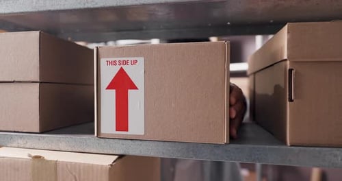 Cardboard box, supply chain and businessman in warehouse for delivery, distribution or shipping