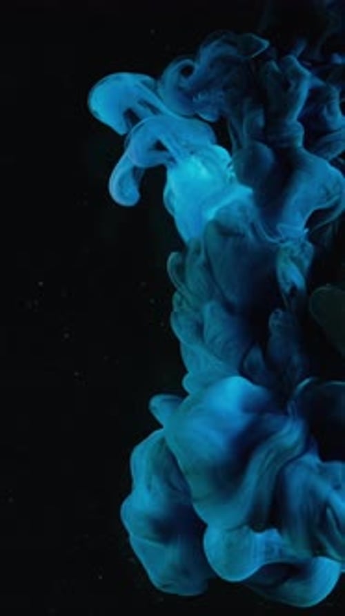 Cyan Ink Flowing on Black Background