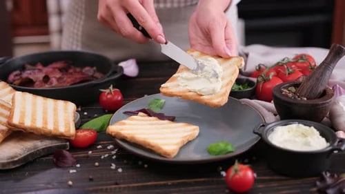 Topping Toast with Cream Cheese in Home Kitchen