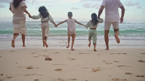Happy Family of Adult People and Children Running to Sea Water of Ocean Beach