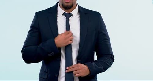 Fashion, suit and tie with a corporate man getting ready closeup in studio on a white background