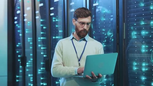 An IT Specialist is Effectively Working in a Data Center That Utilizes Modern Technology