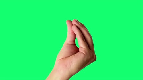 Close up shot of a male hand throwing an Italian-style perfect sign, against a greenscreen backgroun