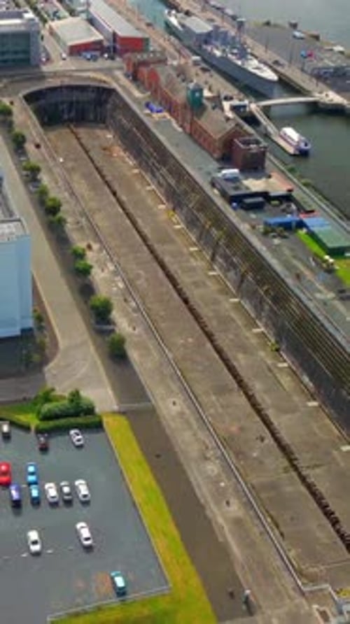 Overhead reversing social ratio aerial video of Thompson Dry Dock in Belfast