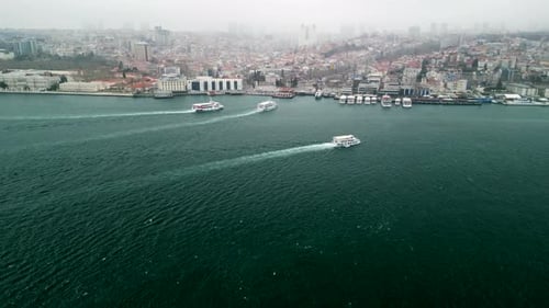 ferries arrive from the Bosphorus strait to the Besiktas Pier ferry terminal