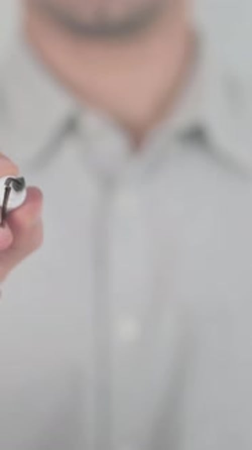 Man Writing the Word Progress on Transparent Surface