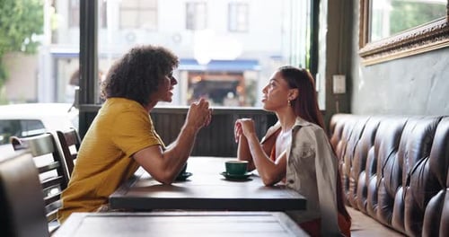 Couple, talking and drinks on date at coffee shop, listen or relax with memory, reunion and bonding