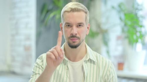 Young Adult Shakes Head No