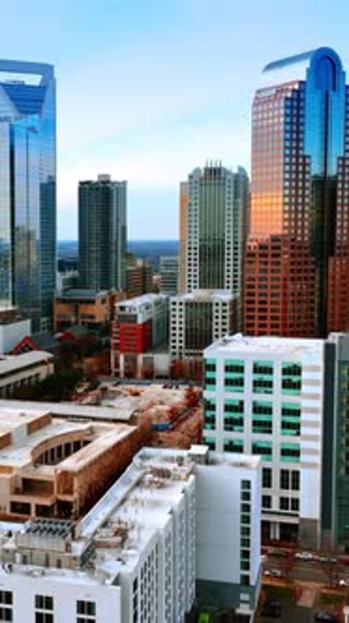 Low-rise architecture neighboring with beautiful modern skyscrapers. Cityscape of Charlotte