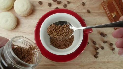 Preparing Instant Coffee with Spoon Top View
