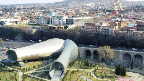 Aerial footage of amazing architecture of Tbilisi with modern concert hall and presidential palace