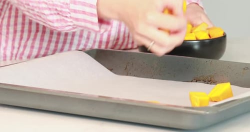 Diced Squash Placed on Baking Sheet for Roasting