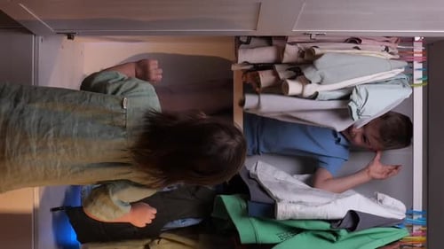 Children Playing in Closet Drawer