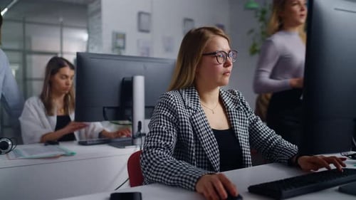 Diverse Women Working In Office Of Modern WebDesign And Marketing Research Company