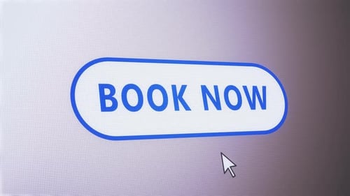 Book Now button pressed on computer screen by cursor pointer mouse