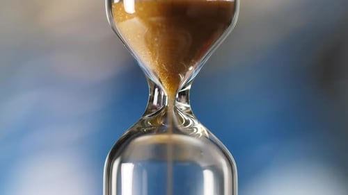 Sandglass Isolated on Blue Background Time is Running Hourglass Closeup