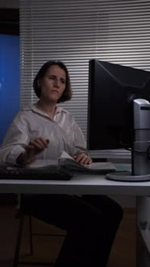 Vertical Video Woman Feeling Intense Neck Pain and Discomfort While Overworking at Her Office Desk