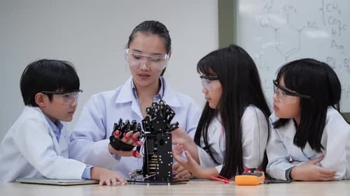 Children and Teacher Learning Robotics in Classroom