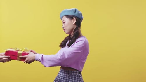 A Stylish Young Woman Dressed in Pastel Colors Posing Against a Bright Yellow Background