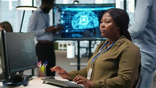 Female Technician Writing Code on PC Developing Neural Networks APIs