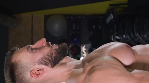 Vertical Video Fitness Caucasian Man Pumping Up Arm Muscles with Dumbbells