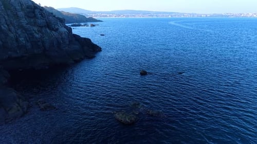 Aerial View of Rugged Coastline and Blue Ocean