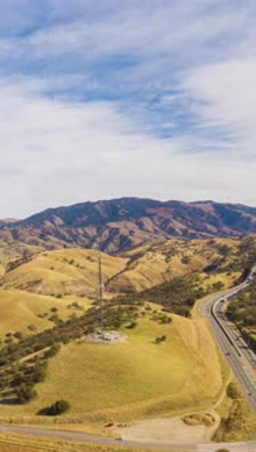 Highway and Hilly Rural Landscape Kern County California USA Aerial View Vertical Video