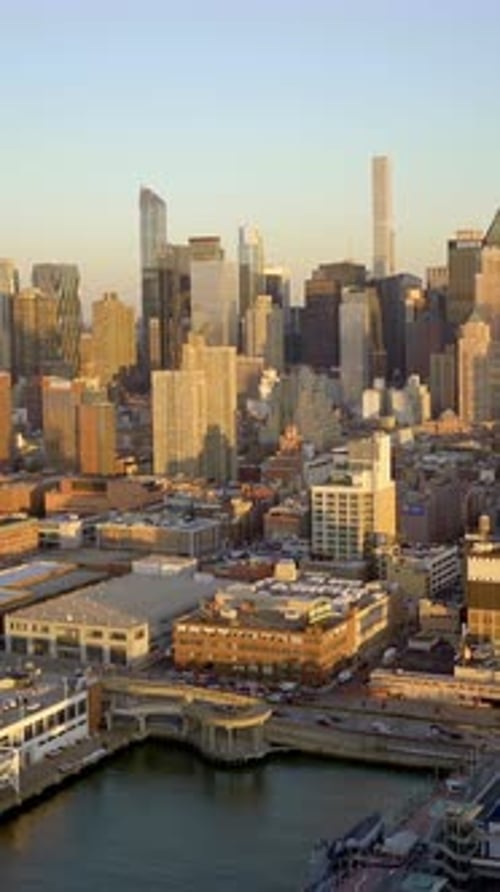 This is a Breathtaking Aerial View Showcasing the Stunning Skyline and Harbor Just at Sunset