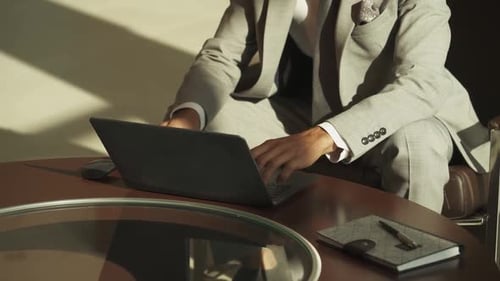 Businessman Working on Laptop in Office