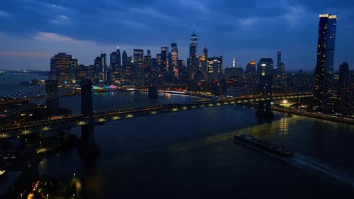 East River, bridges and skyscraper skyline of New York. City view at night.