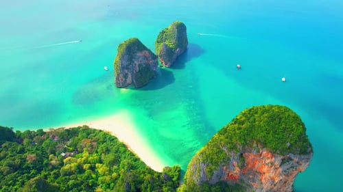 Aerial view from a drone flying over the tropical sea. 4K