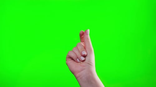 Closeup of Hand Snapping Finger Making Hand Gesture Isolated on Green Chroma Key Background