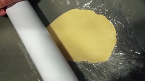 Rolling Pin Flattening Dough for Baking Preparation