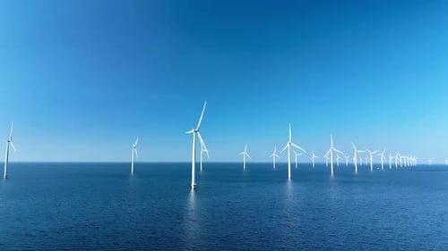 Exploring the Vast Offshore Wind Turbine Park in the Netherlands Under Clear Blue Skies