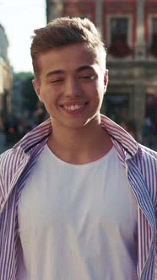 Portrait Attractive Young Man Look at Camera Smile Feel Happy on Street Outdoors Boy Close Up Slow