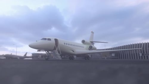 White luxury private jet waiting for passengers on a airfield runway asphalt. Tourist or businessman