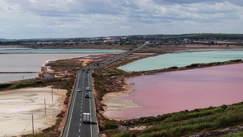 Aerial View of Road Crossing Colorful Salt Lagoons Near Santa Pola Alicante Spain Traffic Old House