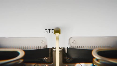 Old mechanical typewriter typing Student in a close-up view.