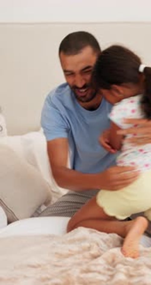 Playful Family Moments on Bed