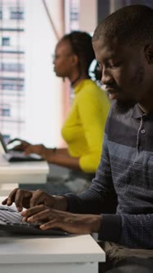 Vertical Video Programmer Doing Software Debugging Asking for Help From Smiling Team Leader