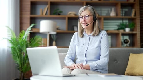 Senior Woman Talking on Laptop Video Conference Call