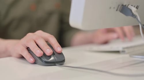 Close up of Woman Using Computer Mouse