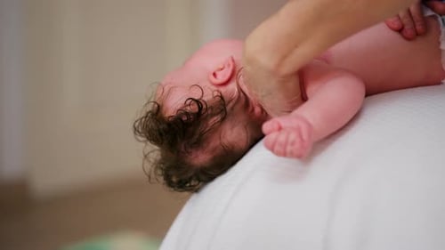 Infant Lying on Back While Receiving Gentle Massage