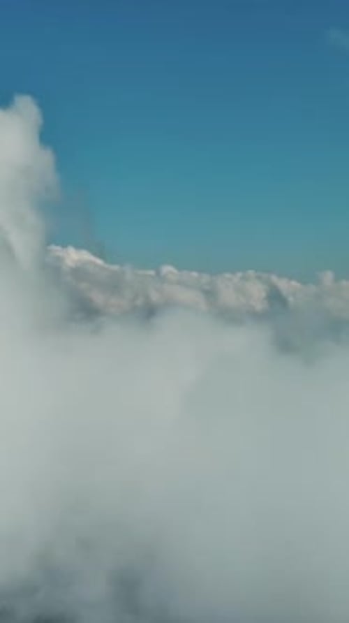 Clouds and mountains, flying in clouds