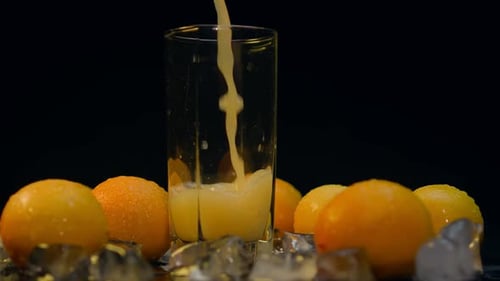 Chilled Orange Juice Pour with Citrus Fruits and Ice