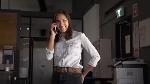 Businesswoman Talking On Smart Phone In Office Slow Motion