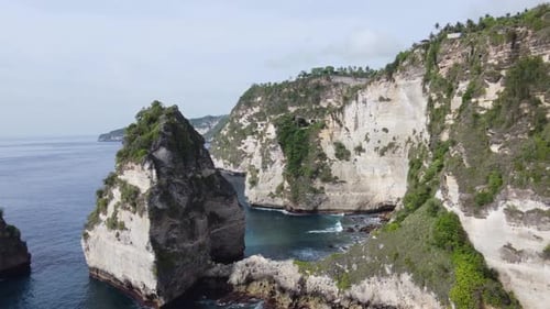 Rugged Landscape scenery of Craggy coast and towering sea stack rocks, Nusa Penida