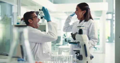 Excited Scientists Celebrate Positive Lab Results