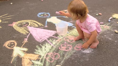 Children Draw with Chalk on the Pavement Selective Focus