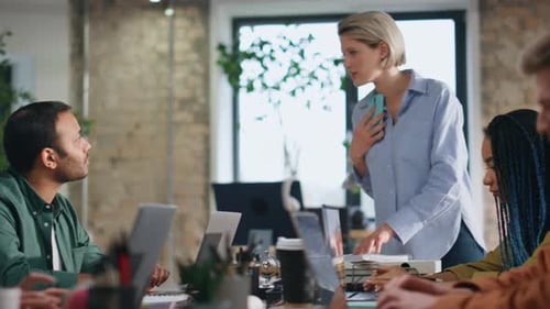Multiracial Team Collaborating Office Conference Room Managers Focused on Work